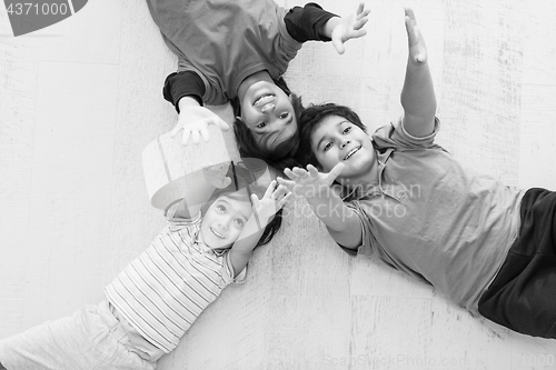 Image of young boys having fun on the floor