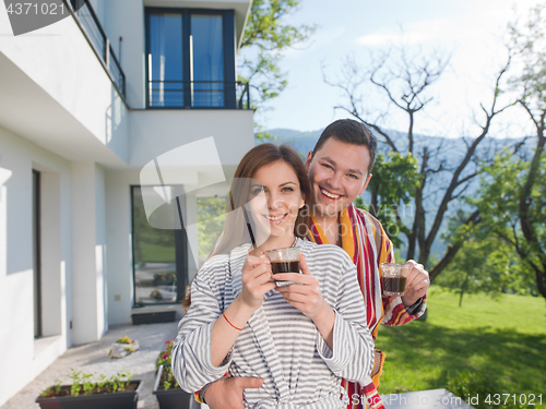 Image of Young beautiful couple in bathrobes