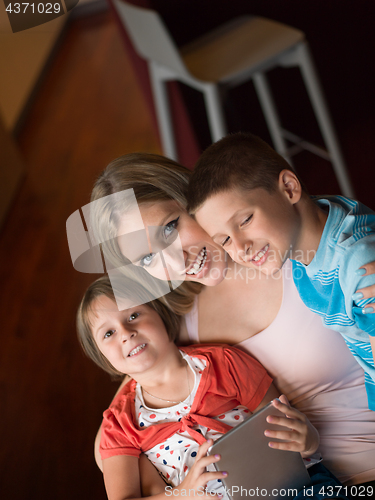 Image of Young Family Using A Tablet To Make Future Plans