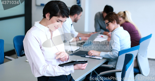 Image of Portrait of  smiling casual businesswoman using tablet  with cow