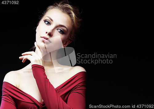 Image of beautiful rich blond woman in elegant dress on black background