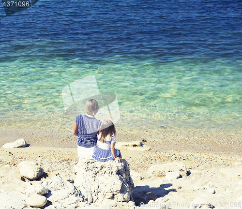 Image of Happy family resting at beach in summer