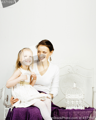 Image of young mother with daughter at home