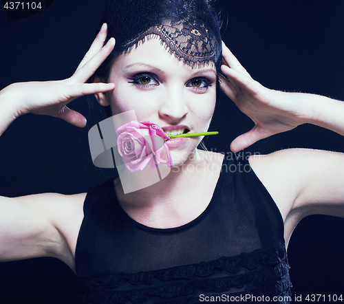 Image of portrait of beauty young woman through lace with makeup and rose fairy