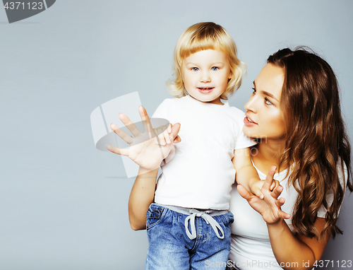 Image of pretty real fashion mother with cute blond little daughter