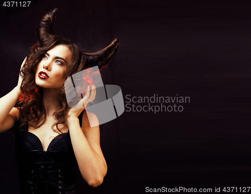 Image of bright mysterious woman with horn hair, halloween celebration