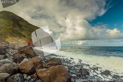 Image of Woman on the beach at a cold day