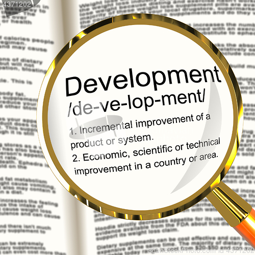 Image of Development Definition Magnifier Showing Improvement Growth Or A