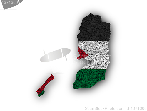 Image of Map and flag of Palestine on poppy seeds