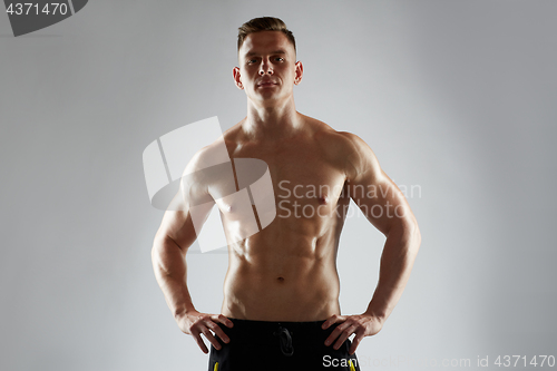 Image of young man or bodybuilder with bare torso