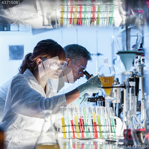 Image of Health care researchers working in scientific laboratory.