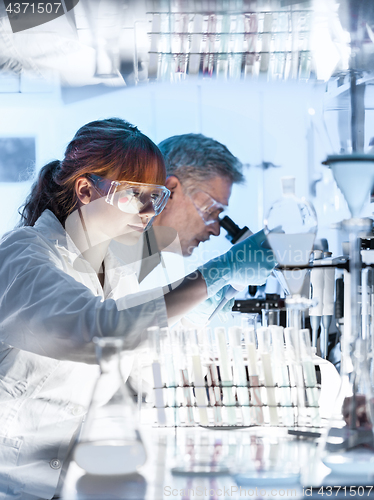 Image of Health care researchers working in scientific laboratory.