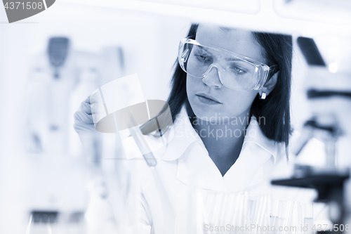 Image of Female chemist working in scientific laboratory.