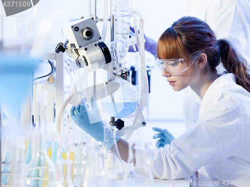 Image of Young female chemists researching in life science laboratory.