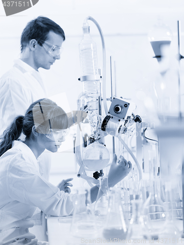 Image of Young chemists researching in life science laboratory.