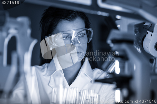 Image of Female chemist working in scientific laboratory.