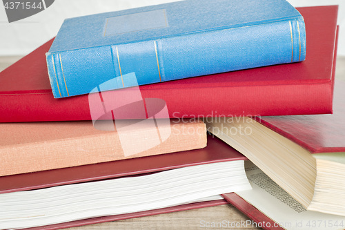 Image of stack of books on the floor