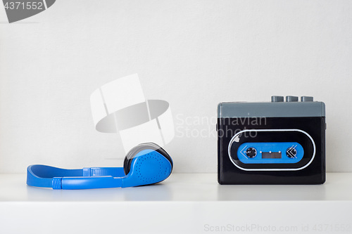 Image of Retro cassette player and headphones on the shelf