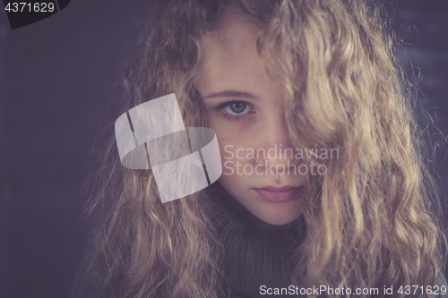 Image of Portrait of a young sad girl.