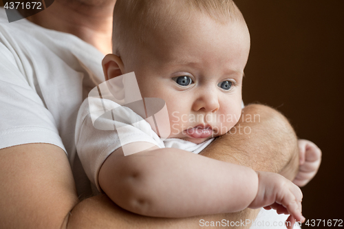 Image of Father Holding Newborn Baby Son