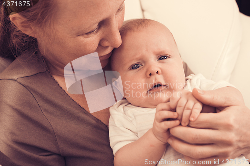 Image of Mother holding sweet baby boy