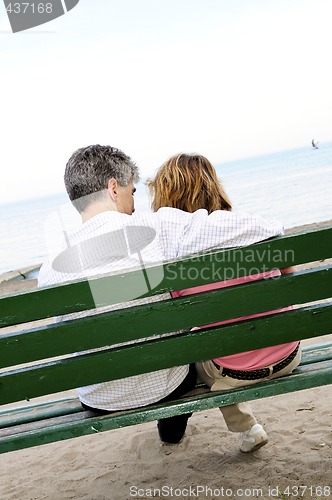 Image of Mature romantic couple on a bench