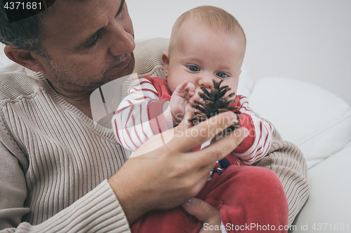 Image of Happy  father having fun with newborn baby son, family portrait 