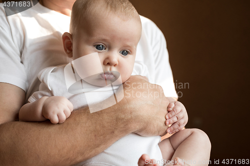 Image of Father Holding Newborn Baby Son