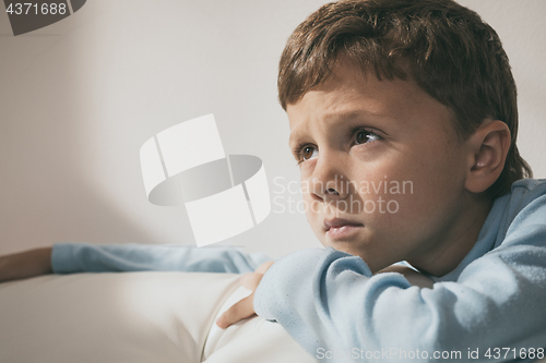 Image of Portrait of a young sad boy.