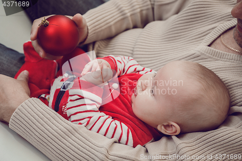 Image of Happy  father having fun with newborn baby son, family portrait 