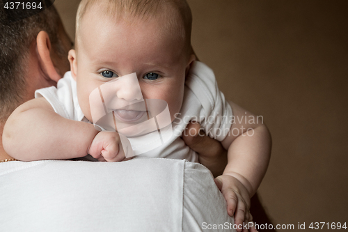 Image of Father Holding Newborn Baby Son