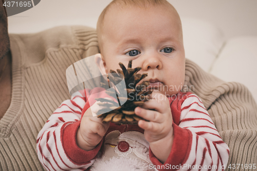 Image of Happy  father having fun with newborn baby son, family portrait 