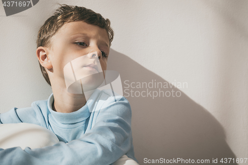 Image of Portrait of a young sad boy.