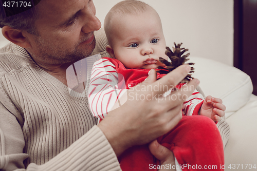 Image of Happy  father having fun with newborn baby son, family portrait 