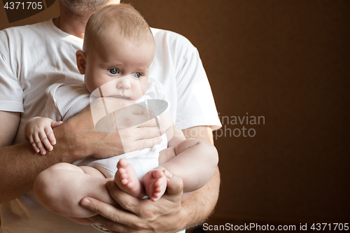 Image of Father Holding Newborn Baby Son