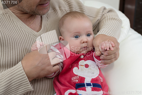 Image of Happy  father having fun with newborn baby son, family portrait 