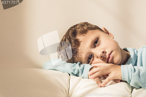 Image of Portrait of a young sad boy.