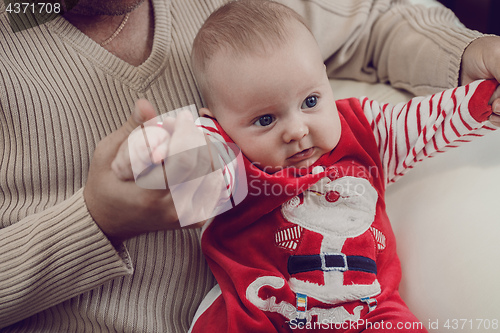 Image of Happy  father having fun with newborn baby son, family portrait 