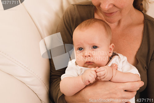 Image of Mother holding sweet baby boy