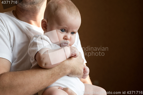 Image of Father Holding Newborn Baby Son