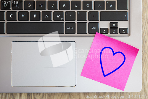 Image of Laptop keyboard with heart note