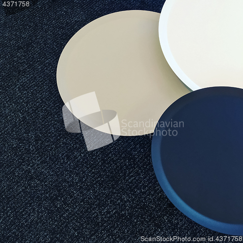Image of Set of round tables on a carpet floor