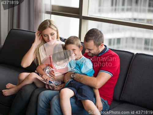 Image of young cuple spending time with kids