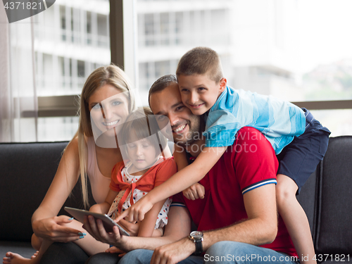 Image of young cuple spending time with kids