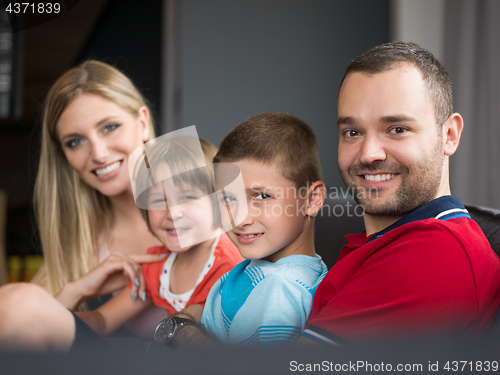 Image of young cuple spending time with kids