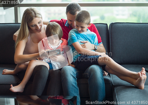 Image of young cuple spending time with kids