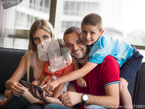 Image of young cuple spending time with kids