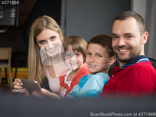 Image of young cuple spending time with kids