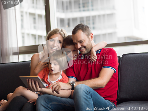 Image of young cuple spending time with kids