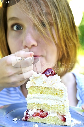 Image of Girl eating a cake